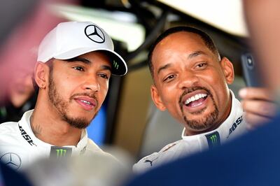 Lewis Hamilton with Will Smith in Abu Dhabi. AFP