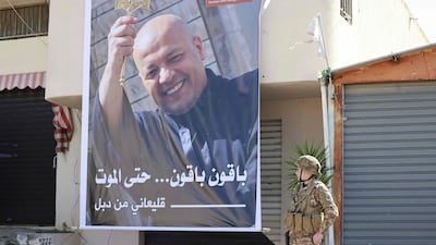 A poster depicting Father Pierre Al Rahi, who was killed in an Israeli strike on the Christian-majority village of Qlayaa. AFP