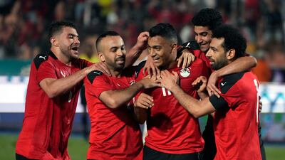 Egypt players celebrate after Mostafa Mohamed scores against Guinea. AP