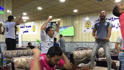 Young supporters of the Real Madrid football club celebrate their team's victory in the Champions League final on May 28, 2016 in the Iraqi town of Balad, two weeks after their fan club was hit by a deadly shooting attack claimed by ISIL. Jean-Marc Mojon/AFP
