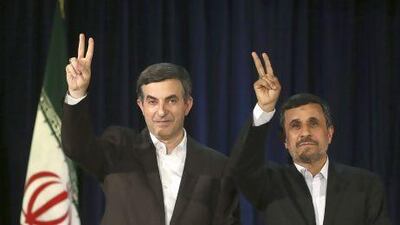 Iranian president Mahmoud Ahmadinejad, right, and his close ally Esfandiar Rahim Mashaei, flash victory signs at the start of their press conference, after registering Mr Mashaei’s candidacy for the upcoming presidential election.