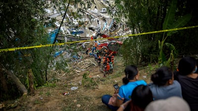 Rescuers search for survivors under an avalanche of rubbish after a landfill mound collapsed in Cebu, in the Philippines. Getty Images