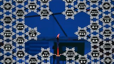 The Olympic flame at the closing ceremony of the Beijing 2022 Winter Games. AFP