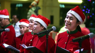UAE residents sing Christmas songs in Mall of the Emirates. Sammy Dallal / The National