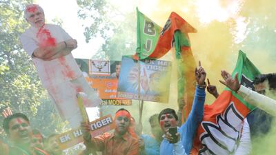 Supporters of India's Bharatiya Janata Party celebrate at the party's headquarters in New Delhi as early results on December 18, 2017 showed the BJP winning state assembly elections in Gujarat and Himachal Pradesh. Rahjat Gupta / EPA