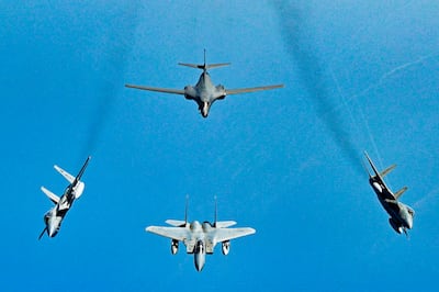 Royal Saudi Air Force F-15 Strike Eagles break away from a US Air Force B-1B Lancer over the Red Sea on Saturday. US Air Force via AP