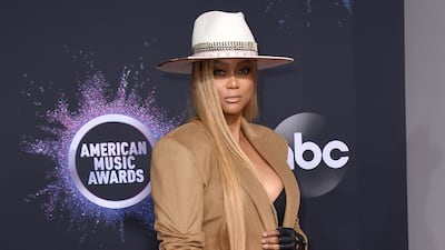 FILE - Tyra Banks arrives at the American Music Awards on Nov. 24, 2019, at the Microsoft Theater in Los Angeles. Banks will host the 30th season of "Dancing With The Stars" alongside returning judges Len Goodman, Carrie Ann Inaba, Bruno Tonioli and Derek Hough. (Photo by Jordan Strauss / Invision / AP, File)