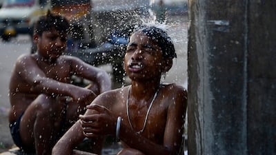 Boys cool off during a heatwave in Jalandhar, India. AFP