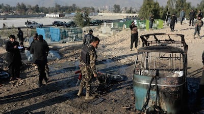 Afghan security personnel inspect the scene of a suicide attack that targeted a funeral ceremony in Jalalabad. Noorullah Shirzada l AFP