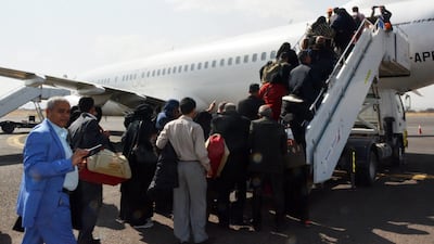 Sick Yemenis and their relatives board a UN medical evacuation plane at Sana'a airport, Yeme. EPA