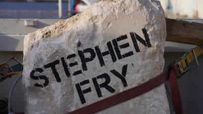 The names of celebrities who support the action are stencilled on the limestone boulders. Photo: Greenpeace