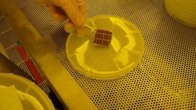 The thin-film solar cells in a “clean room” at Massachusetts Institute of Technology, where Masdar Institute scientists are developing cells that will produce double the amount of energy compared with other cells. Courtesy Masdar Institute
