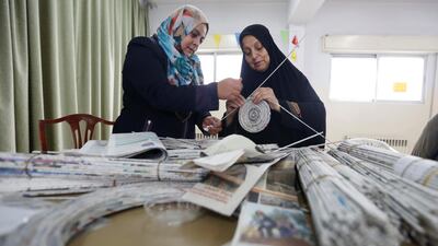 Creatively inclined women recycle newspapers and magazines to create pieces of art and furniture in Amman, Jordan. Reuters