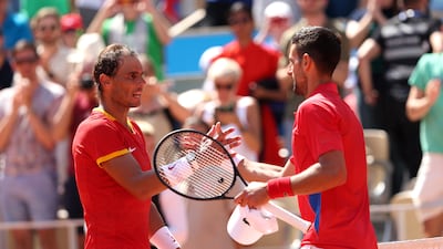 Novak Djokovic, right, is congratulated by Rafael Nadal after winning their second-round match 6-1, 6-4 on Day 3 of the Paris Olympic Games at Roland Garros on July 29, 2024. Getty Images