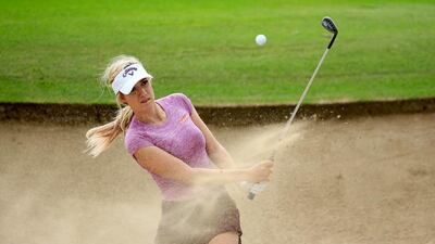 American Paige Spiranac hits out of a bunker during a practice round at the Emirates Golf Club in Dubai on Monday. David Cannon / Getty Images