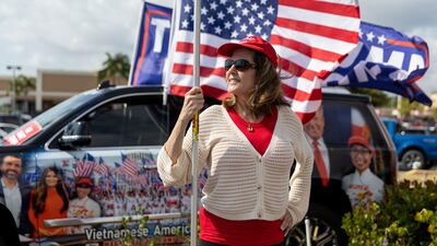 A woman attends a rally for former president Donald Trump on Monday in West Palm Beach, Florida. AP