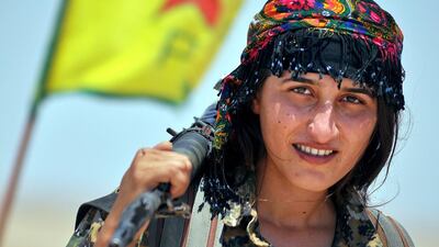 A female fighter from the Kurdish People Protection Unit (YPG) in the Syrian town of Ain Issi. Delil Souleiman / AFP
