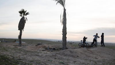Young Bedouin boys play on what is believed to be the site of a future mine estimated to hold 65 million tons of phosphate, in Al Poraa on February 4, 2018. Heidi Levine