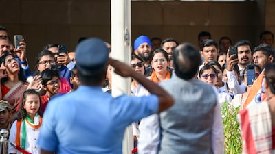 A flag is hoisted on Independence Day at the Indian embassy, Abu Dhabi