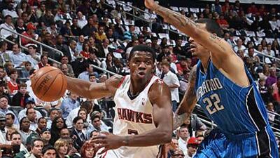 Joe Johnson, left, chose to remain in Atlanta over moving to New York, where he would have been reunited with Mike D'Antoni, his former coach in Phoenix.