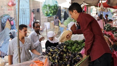 Locals purchase vegetables at a market in the old part of Yemen's southwestern city of Taez on May 13, 2015. Abdel Rahman Abdallah/AFP Photo