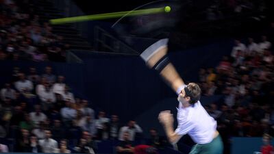 Switzerland's Roger Federer serves a ball to Belgium's David Goffin during their semi-final tennis match at the Swiss Indoors ATP 500 tennis tournament in Basel. Fabrice Coffrini / AFP Photo