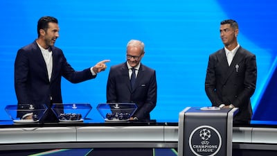 Former Italian goalkeeper Gianluigi Buffon, left, and Cristiano Ronaldo during the Champions League league phase draw in Monaco. AP