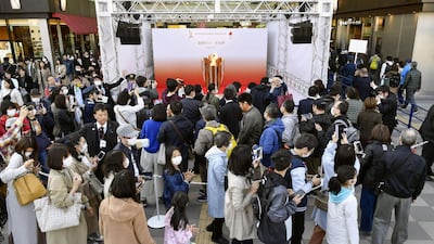 People queue as they try to watch the Olympic cauldron during the Tokyo 2020 Olympics Flame of Recovery tour at Sendai Station, Miyagi prefecture, on Saturday. Kyodo/Reuters