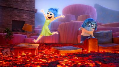 Joy, left, voiced by Amy Poehler, and Sadness, voiced by Phyllis Smith, in Inside Out. Courtesy Disney / Pixar