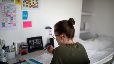 Lise, a student at the International Bilingual School (EIB), attends her online lessons in her bedroom in Paris as a lockdown is imposed to slow the rate of the coronavirus disease. Reuters
