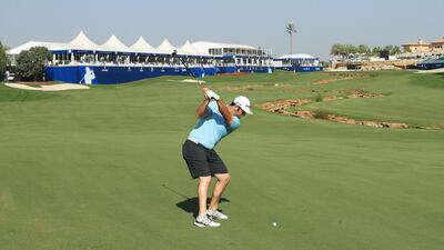 Jon Rahm of Spain plays his second shot on the 18th. Andrew Redington / Getty Images