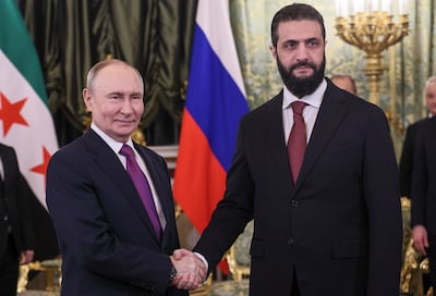 Russian President Vladimir Putin and Syrian President Ahmad Al Shara at the Kremlin in Moscow. EPA
