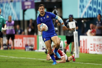 Mattia Bellini of Italy breaks before scoring his team's fifth try against Canada. Getty