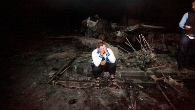 A man reacts is pictured at the site of an ISIL-claimed suicide attack at a petrol station in the city of Hilla, south of Baghdad, on November 24, 2016. Alaa Al Marjani/Reuters