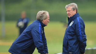 Manager of England Roy Hodgson in conversation with Ray Lewington during an England training session at St Georges Park on May 30, 2016 in Burton on Trent, England. (Photo by Ben Hoskins/Getty Images)