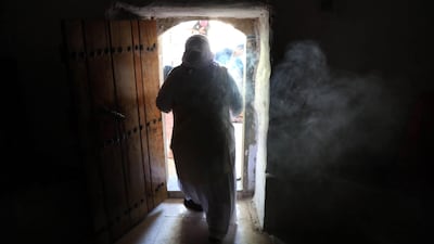An Iraqi Yezidi woman visits the Temple of Lalish, in a valley near the Kurdish city of Dohuk about 430km northwest of the capital Baghdad, on July 16, 2019. AFP