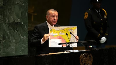 Recep Tayyip Erdogan, Turkey's president, holds up a map while speaking during the UN General Assembly meeting. Bloomberg