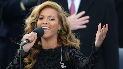 Beyoncé and her large mic. AFP / Stan Honda