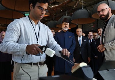 Oman's Sultan Haitham is shown a demonstration of a surgical procedure by the robotics and AI company Panda Surgical. AFP