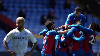 Tyrick Mitchell of Crystal Palace is surrounded by teammates after scoring. EPA