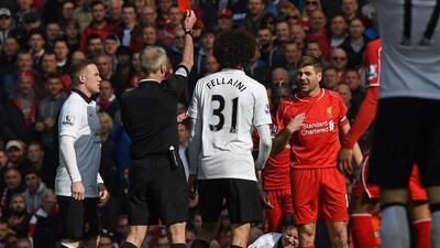 Liverpool's Steven Gerrard is shown red on Sunday during his side's Premier League loss to Manchester United after his foul on Ander Herrera. Paul Ellis / AFP