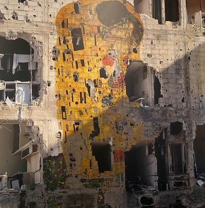 Many thought Tammam Azzam's 'Freedom Graffiti', 2013, was a real image of Gustav Klimt's 'The Kiss' graffitied onto a ravaged building in Syria. However, it was photoshopped in Dubai. Courtesy Middle East Institute