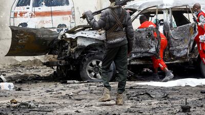 A police officer keeps watch following a suicide car bomb explosion in Mogadishu, Somalia. The British defence secretary has warned of a rise in Al Shabab attacks. Reuters.