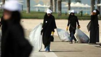 Zayed University students clean up garbage on the Corniche beach last March.