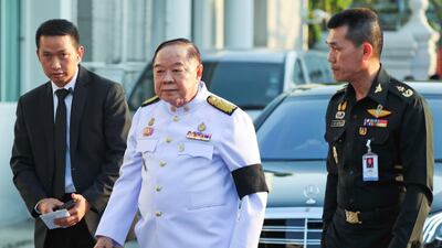 Thailand's Deputy PM Prawit Wongsuwan arrives at the temple. Reuters