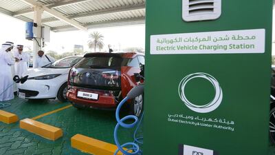 Electric cars were on display at the launch of an electric car-charging station at Dewa headquarters in Dubai earlier this year. About 25 car parks in Dubai, four in Abu Dhabi and two in Sharjah will feature free charging facilities this year. Pawan Singh / The National