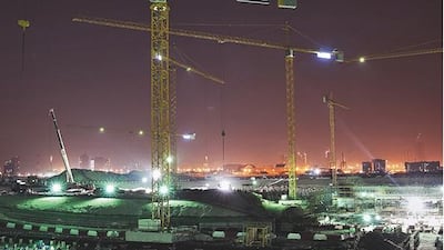 Construction on the Louvre Abu Dhabi goes on night and day on Saadiyat Island. Silvia Razgova / The National