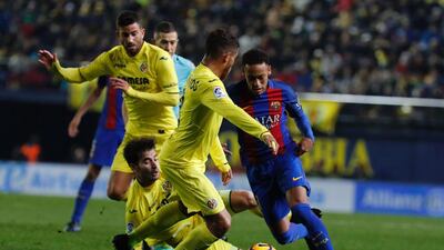 Neymar vies for possession with Jonathan dos Santos, second right, Manu Trigueros, second left, and Mateo Musacchio all defending. Jose Jordan / AFP