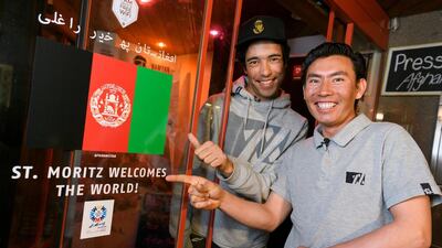 Afghan skiers Alisha Farhang (L) and Sajjad Husaini at the 2017 FIS Alpine World Ski Championships in St. Moritz on February 15, 2017 Fabrice Coferini / AFP