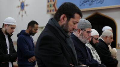 (Left to right) Sheik Khaled Zreika and Sheikh Yahya Safi, Imam of Lakemba Mosque pray with members of the community during a live online prayer event at Lakemba Mosque in Sydney, Australia. Getty Images